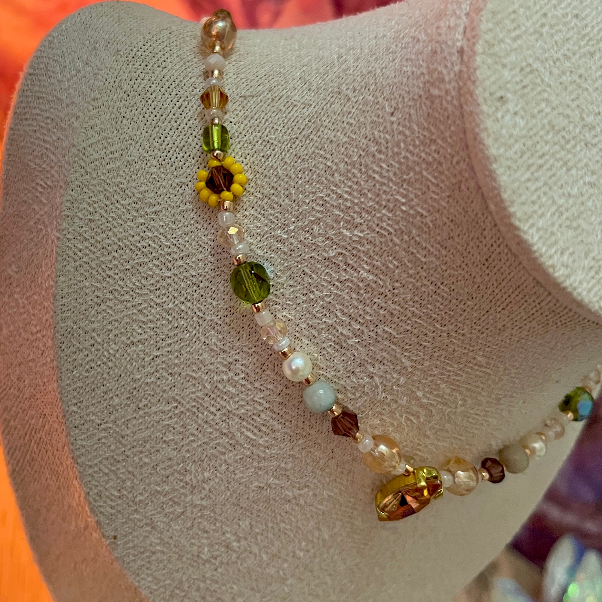 Necklace with colorful beads on a mannequin bust