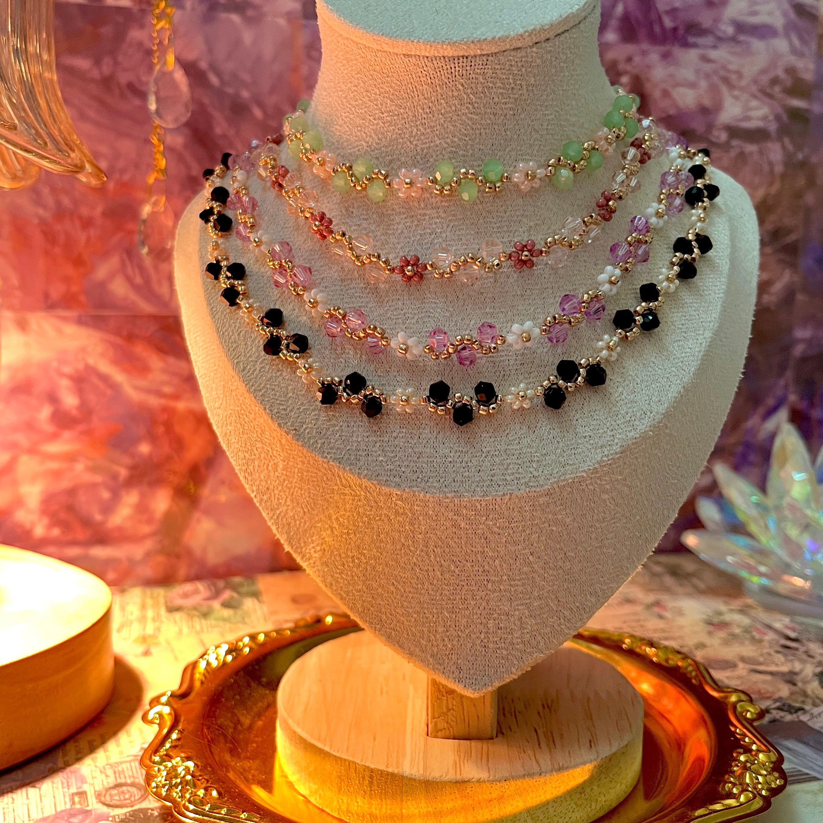 Flower Necklace set on a mannequin bust with a decorative background